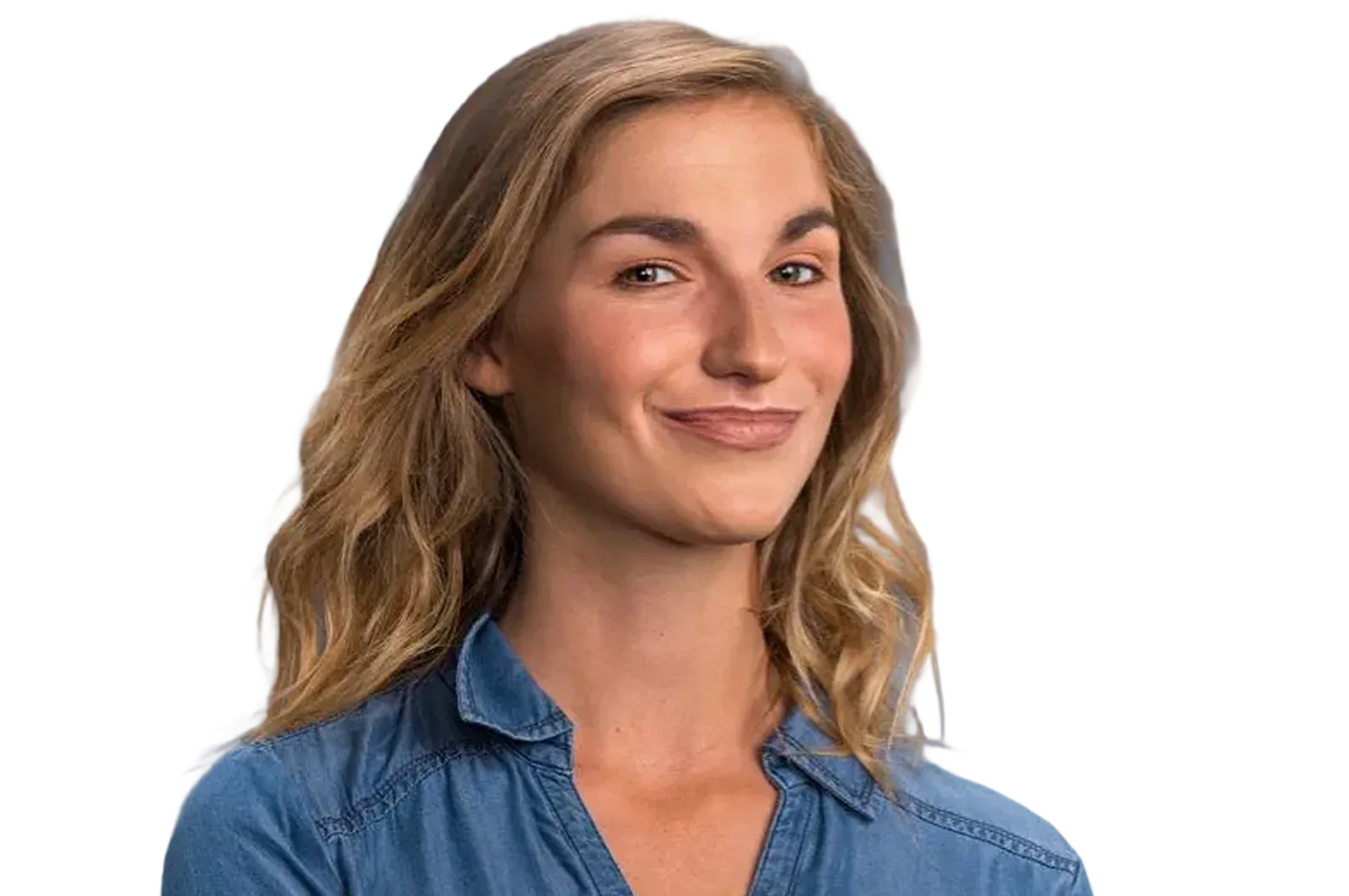 Smiling woman with wavy blonde hair wearing a blue denim shirt.